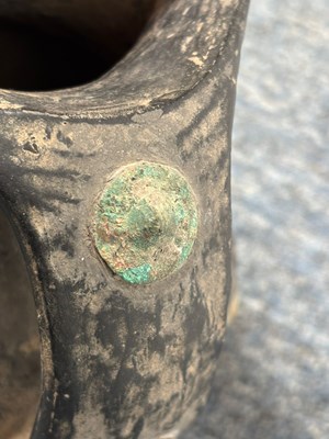 Lot 9 - HAN DYNASTY TWIN HANDLED BLACK POTTERY WITH METAL STUDS 汉代 黑陶嵌铜泡钉双耳壶