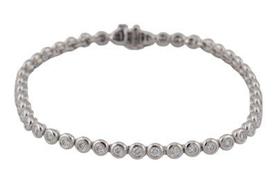Lot 25 - 18CT WHITE GOLD & DIAMOND LINE BRACELET