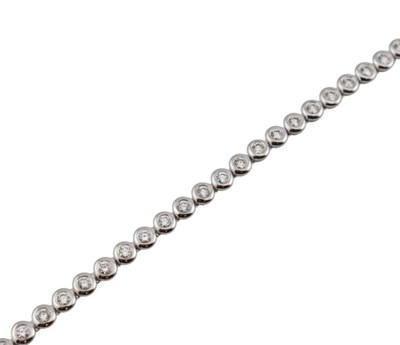 Lot 25 - 18CT WHITE GOLD & DIAMOND LINE BRACELET
