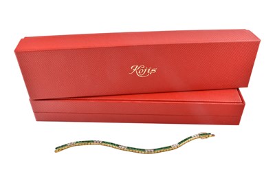 Lot 11 - KOJIS - 18CT GOLD EMERALD & DIAMOND TENNIS BACELET