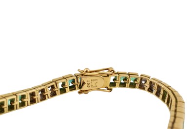 Lot 11 - KOJIS - 18CT GOLD EMERALD & DIAMOND TENNIS BACELET