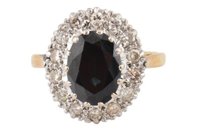 Lot 177 - HALLMARKED 18CT GOLD SAPPHIRE & DIAMOND HALO RING