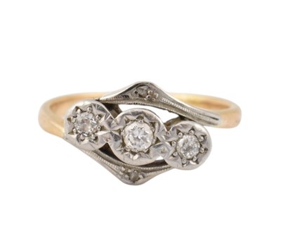 Lot 112 - 18CT GOLD & DIAMOND THREE STONE CROSSOVER RING