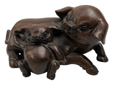 Lot 148 - JAPANESE WOOD CARVED NETSUKE INFORM OF TWO PIGS 日本木刻根付
