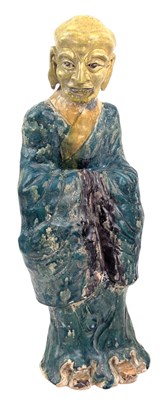 Lot 34 - CHINESE GREEN GLAZED POTTERY FIGURE OF A MONK / LOHAN / ARHAT 素三彩罗汉立像