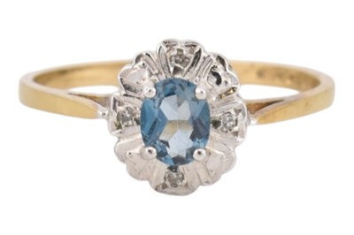 Lot 424 - HALLMARKED 9CT GOLD TOPAZ AND DIAMOND HALO RING