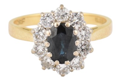 Lot 162 - HALLMARKED 18CT GOLD SAPPHIRE & DIAMOND HALO RING