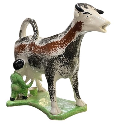 Lot 75 - 19TH CENTURY SPONGEWARE COW CREAMER WITH MILKMAID