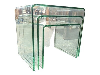 Lot 599 - CONTEMPORARY MINIMALIST BENT GLASS NEST OF TABLES