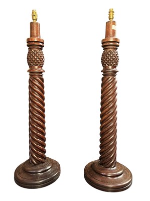Lot 335 - PAIR OF EARLY 20TH CENTURY CARVED MAHOGANY PINEAPPLE TALL LAMP BASES