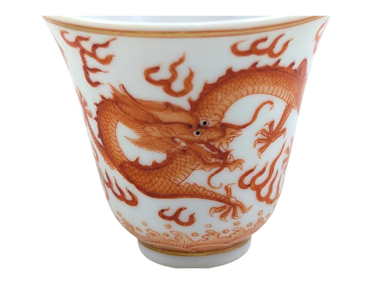 Lot 8 - QING GUANGXU IRON RED & GILT DRAGON PORCELAIN WINE CUP 清 光绪 矾红彩龙纹杯
