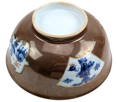 Lot 68 - 18TH CENTURY QING DYNASTY KANGXI BATAVIAN BROWN BOWL 康熙紫金釉开光青花五彩花卉纹大盌