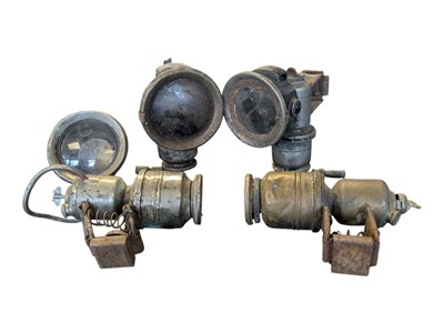 Lot 217 - FIVE EARLY TO MID 20TH CENTURY CARBIDE BICYCLE / MOTORCYCLE LAMPS