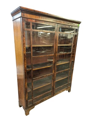 Lot 748 - 18TH CENTURY FIGURATED WALNUT BOOKCASE