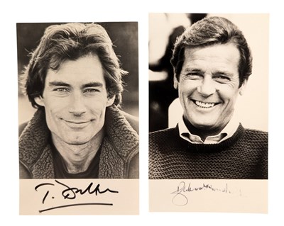 Lot 27 - ACTORS - TIMOTHY DALTON & ROGER MOORE - JAMES BOND 007 SIGNED PHOTOGRAPHS