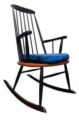 Lot 4 - ROLAND RAINER - MID 20TH CENTURY EBONISED ROCKING CHAIR